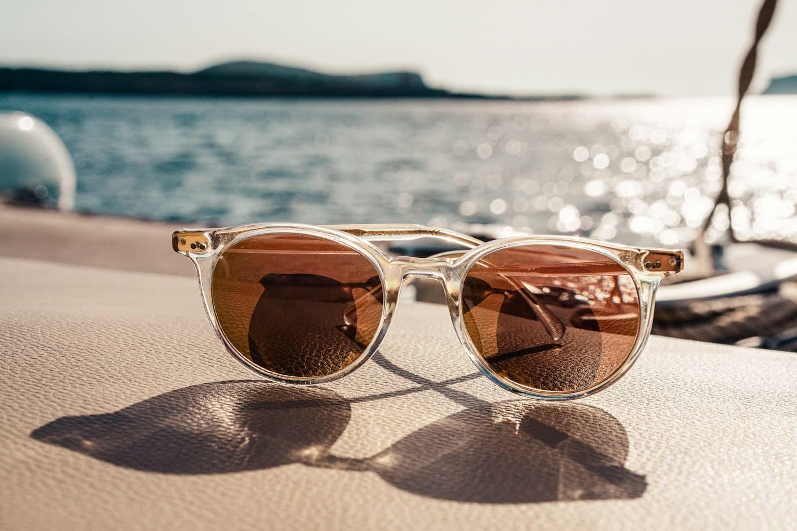 Clear-frame sunglasses by the sea
